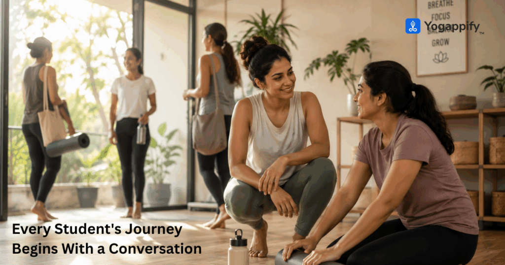 Yoga teacher having a warm conversation with a student after class, representing ethical sales through trust, guidance, and honest communication.